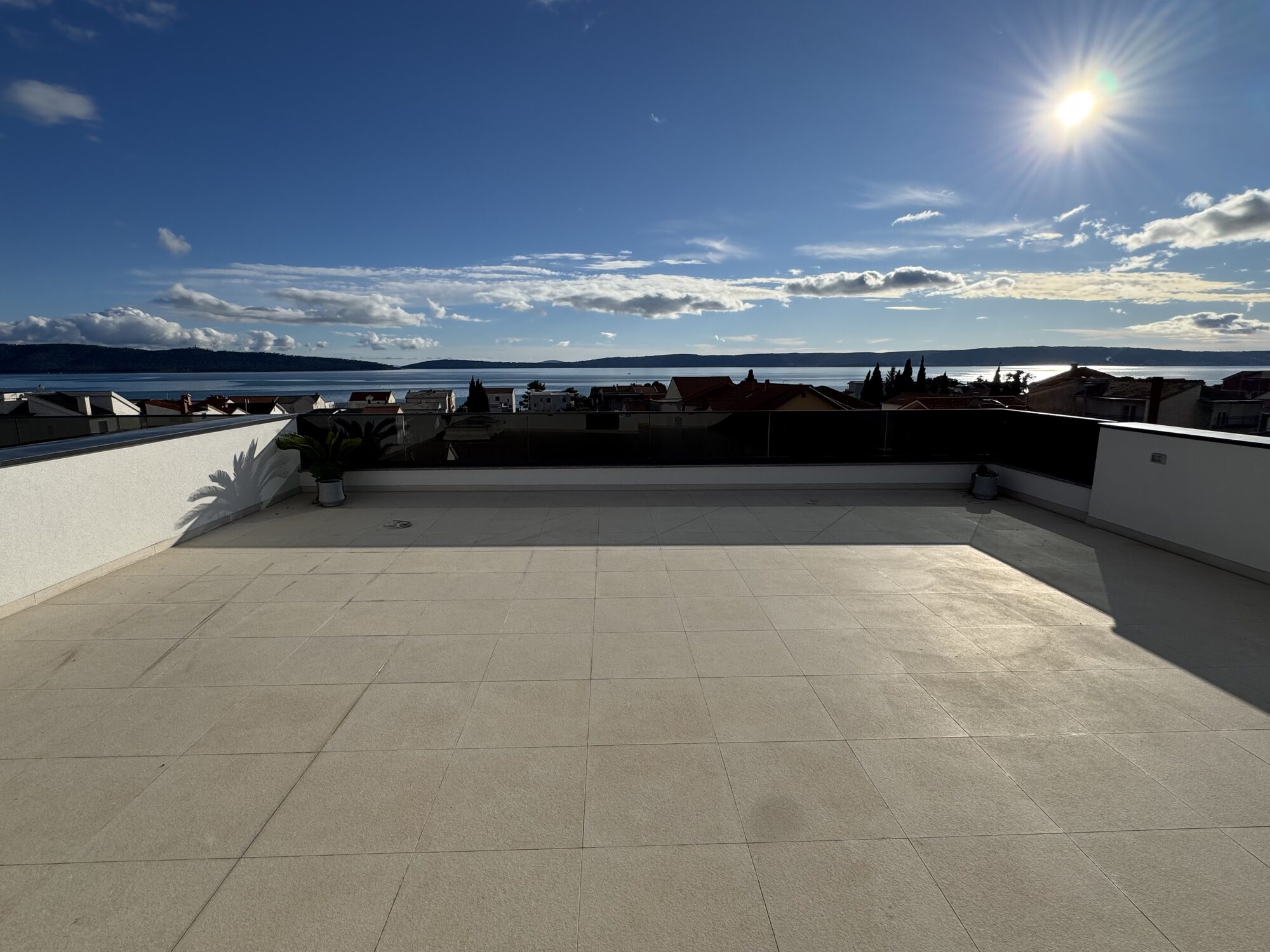 Private rooftop terrace with panoramic Adriatic views at golden hour